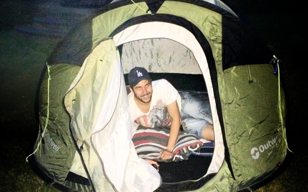 Nicholas Moon in the tent in his parents garden.